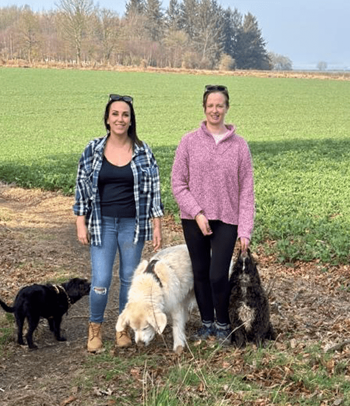photograph of michelle and beth walking the dogs