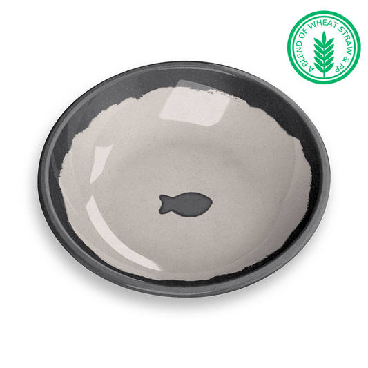 light brown saucer with a dark brown edge and fish in the bottom