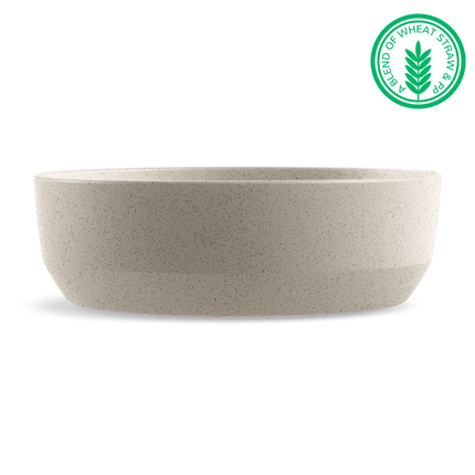 Beige bowl with a green label indicating a blend of wheat straw on a white background
