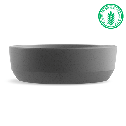 Gray bowl with a green label indicating a blend of wheat straw on a white background