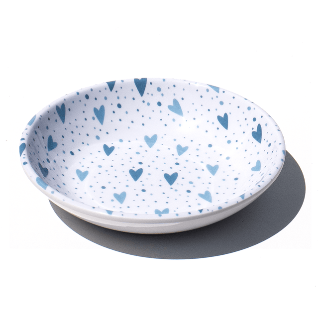 white saucer with blue hearts