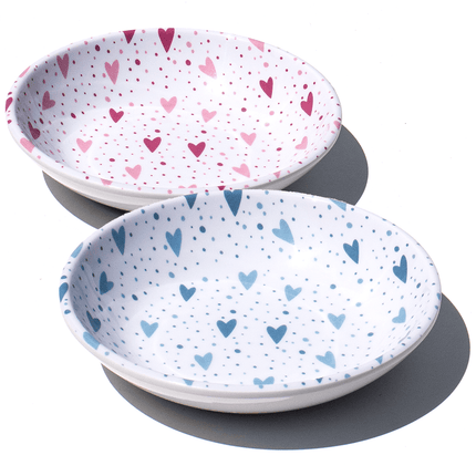 group shot of pink and blue hearts on a white saucer