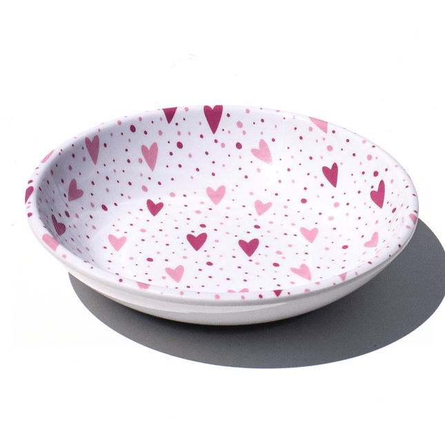 white saucer with pink hearts